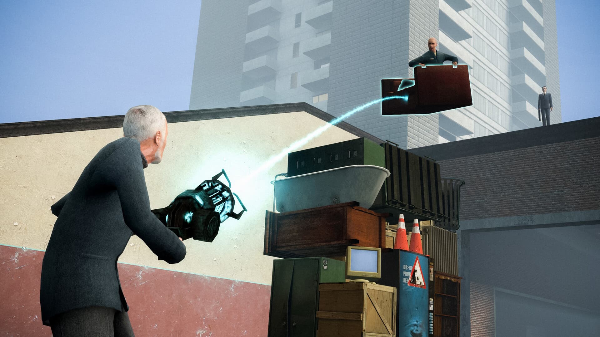 A player lifts a stack of furniture with the physics gun while two suited figures watch from a rooftop